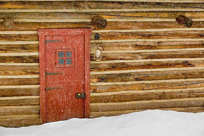 [© Red Cabin Door II by Judy Hill is described with Lenado, Woody Creek, Colorado, Barns, Buildings, Cabin, House, Old Buildings, Snow, Snowy, Door, Lantern, Antiques, Old things, things, Window, Beige, Black, Brown, Cool, golden, Neutrals, Reds, Warm, White, Yellows, Mountain, Mountains, Ranches, Farm, Rural, 2004, Winter, Close, Horizontal, Fine Art, Stock, Color hit 15971 rate ]