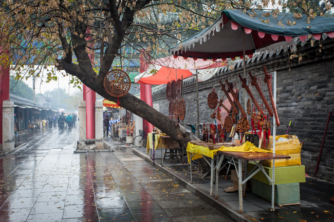 [© Rainy Street Market by Judith Hill Lovins is described with Fine Art, Renaissance Show, China, Color, Horizontal, Neutral, Rain, sidewalk shops hit 10476 rate ]